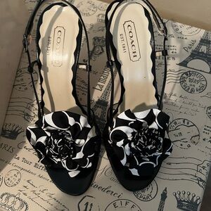 Coach black signature flower heels.
